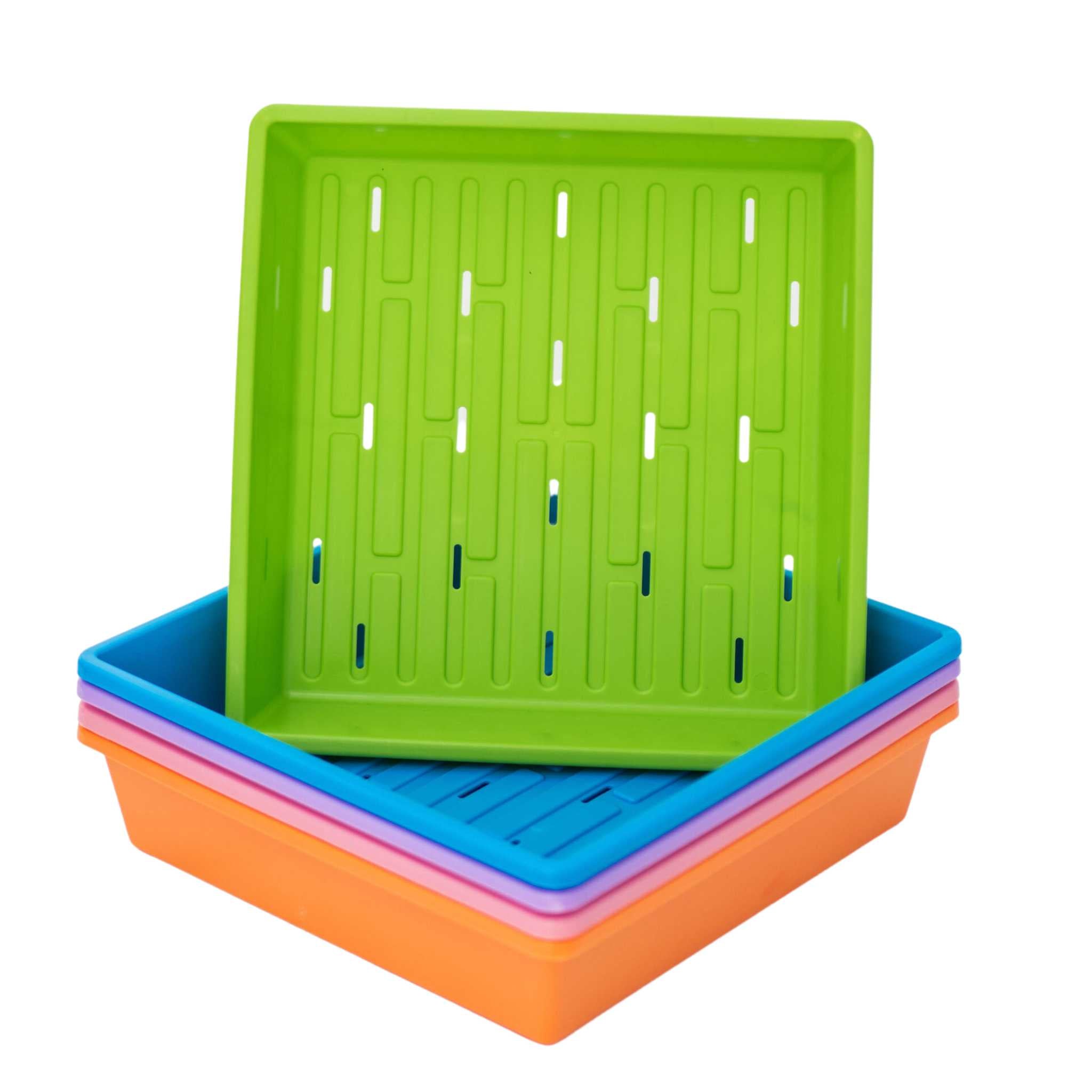 Stack of colorful plastic trays on a white background