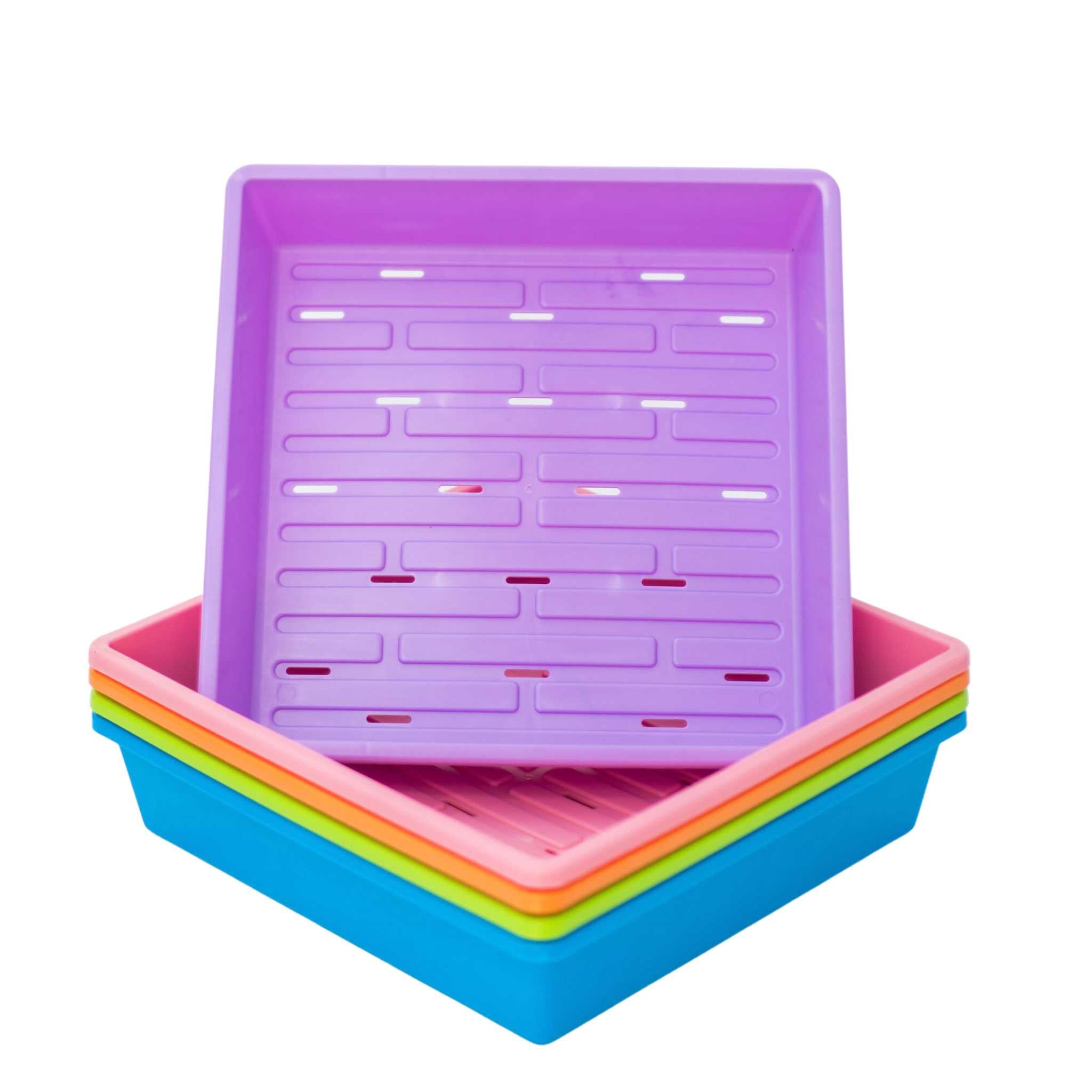 Stack of colorful plastic trays with a purple top tray on a white background