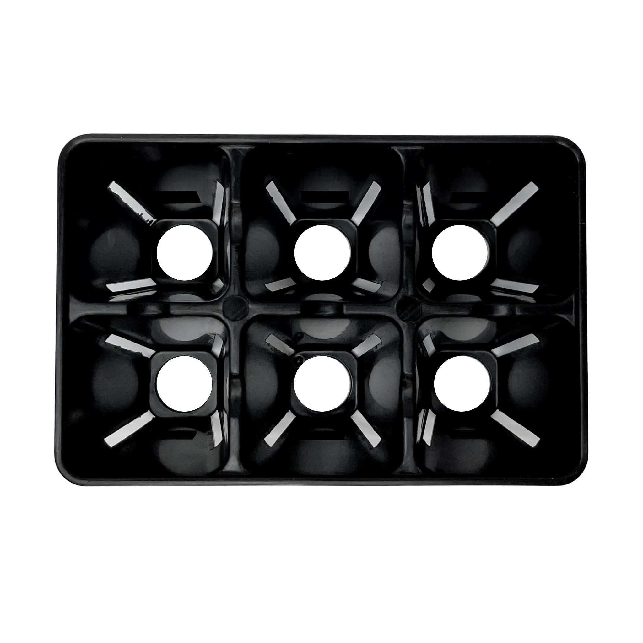 black plastic seed tray inside showing holes on white background 