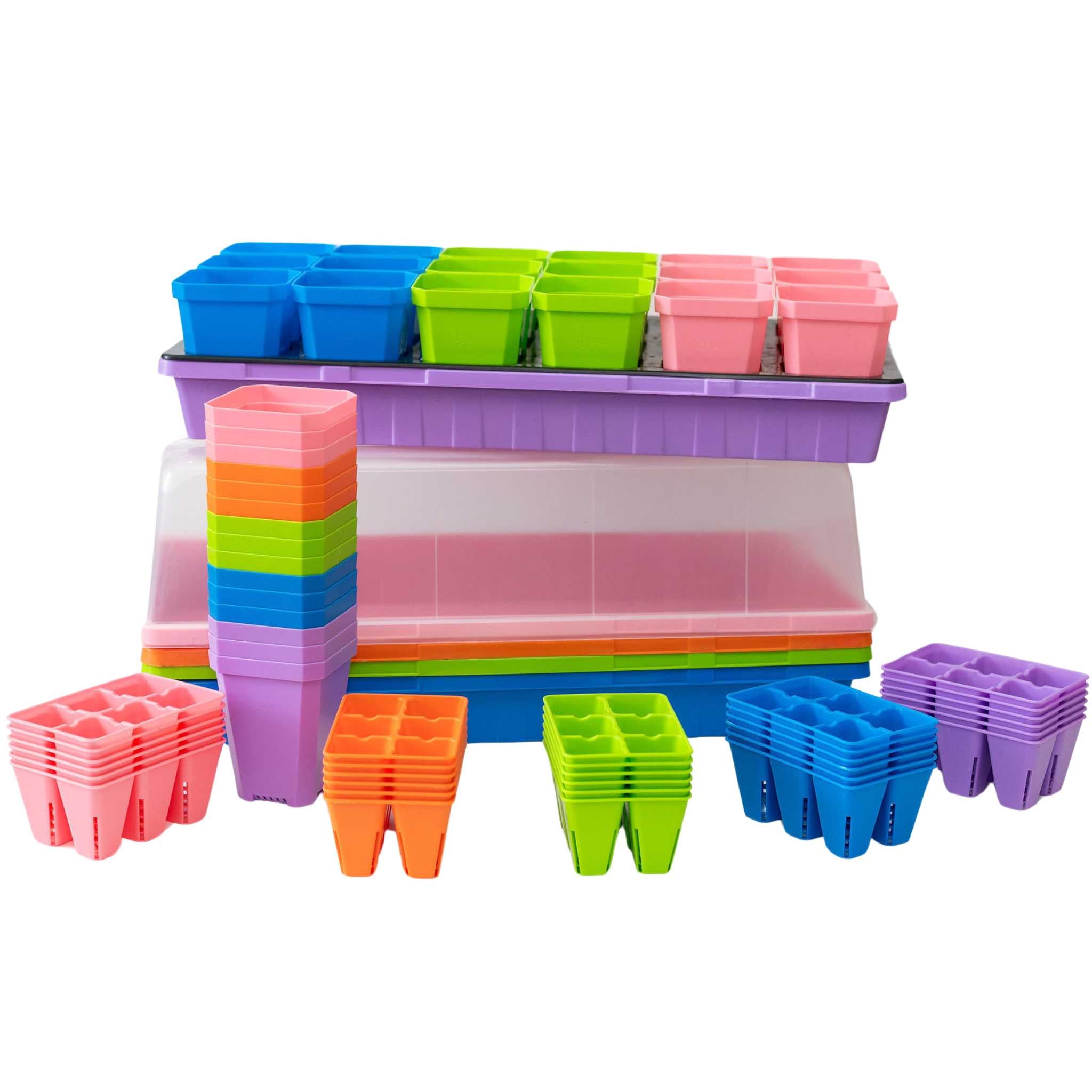 Colorful plastic seedling trays and pots on a white background 